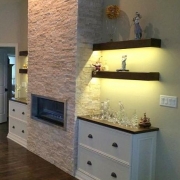 fireplace and floating shelves